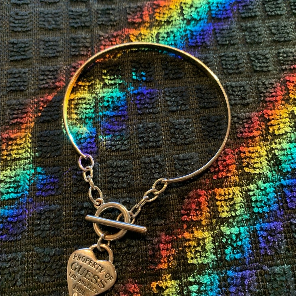 GUESS Gold Heart Charm Bracelet with Toggle Closure